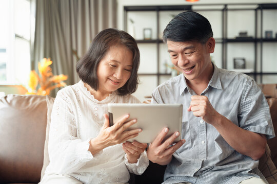 Scene Couple Of Asian Elderly Make A Video Conference Call By Smartphone During Self Isolation At Home While Covid19 Epidemic.