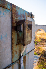 Old electric switch on a concrete wall