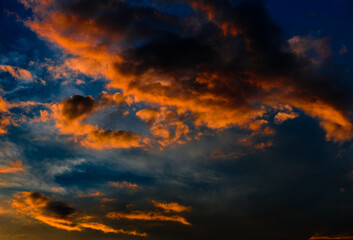 Fototapeta na wymiar Beautiful sunset. Red clouds in the dark blue sky