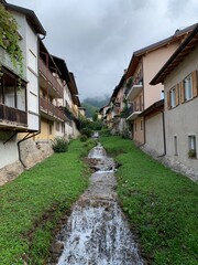 River going through the village of Levico, Italy