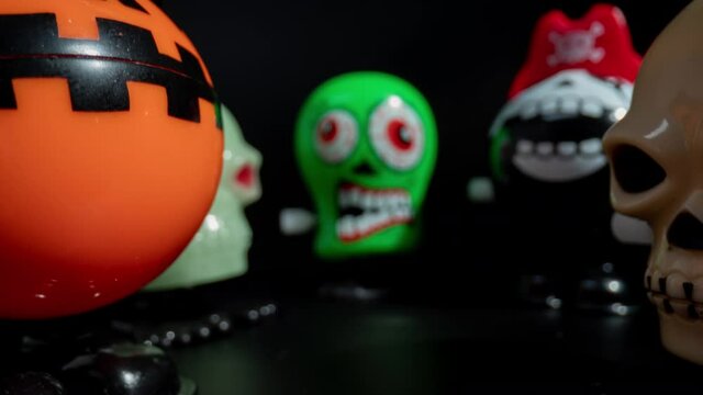 Plastic halloween toys with close up of green skull