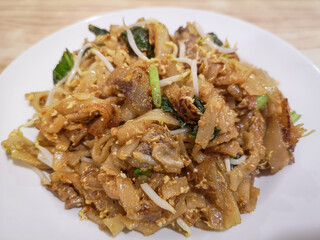 Fried Char Kway Teow with beef meat and bean sprouts and vegetables