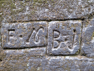 Engraved numbers and letters indicating the owner