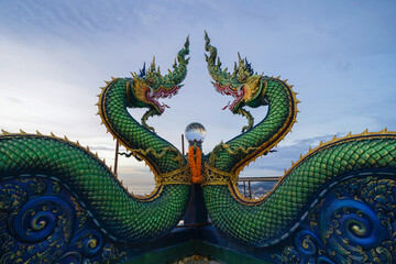 Head of Naga snake in Wat Khao Phra Kru Temple, Si Racha District, Chonburi, Thailand. Landmark tourist attraction. Thai architecture. - obrazy, fototapety, plakaty