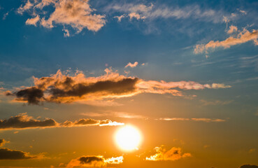 The sun and orange clouds. Beautiful sunset sky