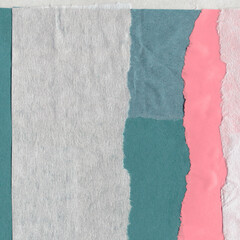 Colorful torn paper collage close-up. Texture made from various paper and cardboard parts. Damaged...