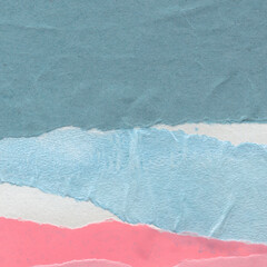 Colorful torn paper collage close-up. Texture made from various paper and cardboard parts. Damaged...