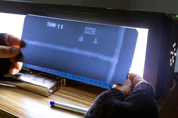 The radiography film operator level 2 evaluation radiographs of the welds with viewer and he is...
