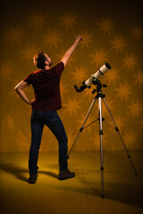 Amateur astronomer looking at the stars with a telescope. Astronomy and astrology concept.