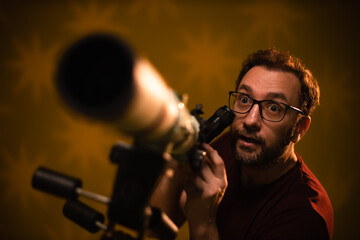 Amateur astronomer looking at the stars with a telescope. Astronomy and astrology concept.