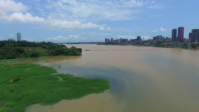 Aerial view of the Ébrié lagoon near Abidjan. The largest city in the Ivory Coast. Plateau area in the background.