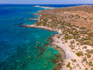 Crete Coast Line with turquoise colored water and lonely Beach from Top 