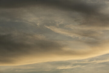 Fototapeta premium Beautiful sunset sky above clouds with dramatic light