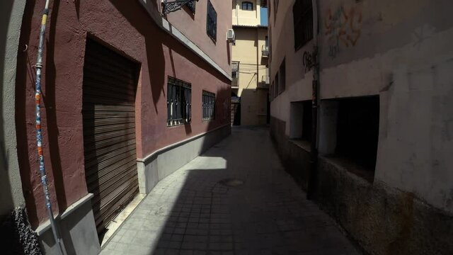 Camera slides trough an atmospheric alley in Spain.
