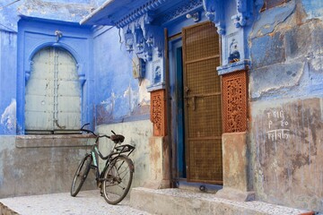 old door and bicycle on a house courtyard, Jodhpur, Rajasthan, India 