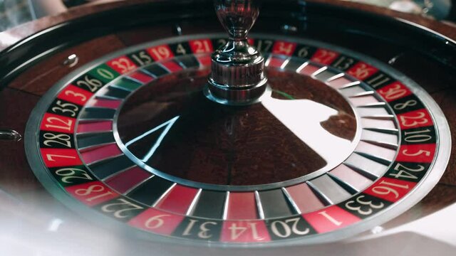 Casino roulette in motion, the spinning wheel ball