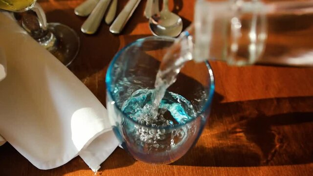 Pouring Water into a Glass in Slow Morion