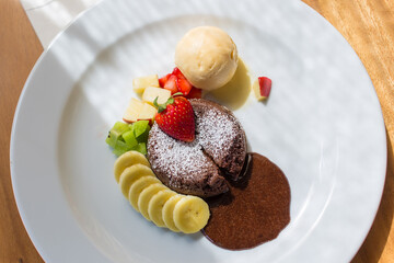 Chocolate Lava Vanilla ice cream with fruit.