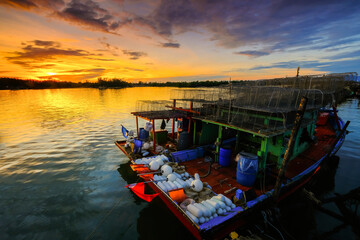 Parked fishing boat during sunset at Kuala Besut