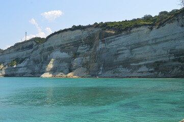 The beautiful turquoise ocean in the Ionian Sea surrounding the island of Corfu, Greece