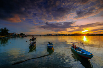 Parked fishing boat during sunset at Kuala Besut