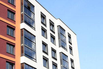 Close view of Russia skyscrapper with windows, blue sky background