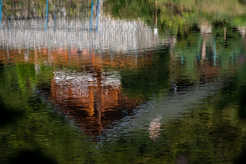 colorful building on the river bank reflected on the surface
