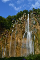 Fototapeta premium The pathways around the turquoise clear water in the Plitvice Lakes National Park in Croatia