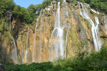 The pathways around the turquoise clear water in the Plitvice Lakes National Park in Croatia