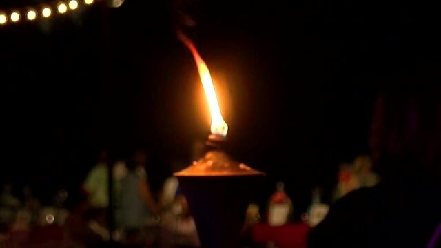 tiki torch at night