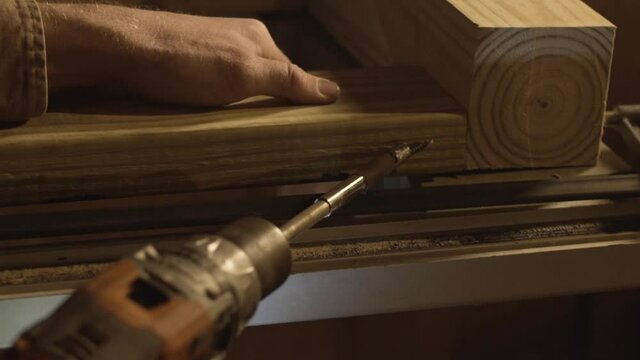 Drilling screw into wood in slow motion