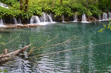 The turquoise waters from the stunning waterfalls in the Plitvice Lakes National Park in Croatia