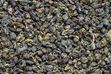 Green tea leaves background and texture, macro shot