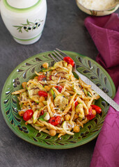 
Rustic homemade italian pasta with roasted vegetables and parmesan cheese