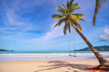 Summer beach with palms trees around in Patong beach Phuket island Thailand, Beautiful tropical beach with blue sky background in summer season.
