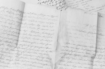 closeup of old handwriting; vintage paper background