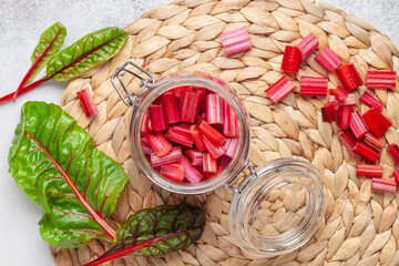 Sweet chard stalks cut for pickling in a jar on the table. Top View