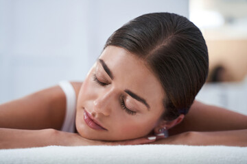 Obraz na płótnie Canvas Woman enjoying back massage with closed eyes