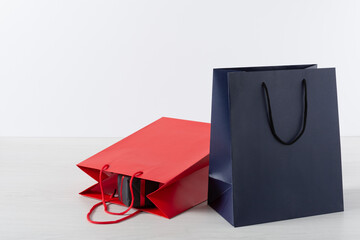 Group of colorful paper shopping bags over white background.