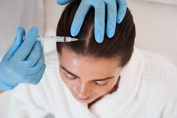 Cosmetic been injected in woman's head