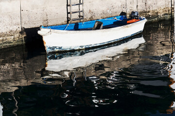Fototapeta na wymiar Fishing Boats Docked at a Harbor