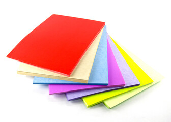 Various colored papers stacked up vertically as a stationery, used for making reports or books.