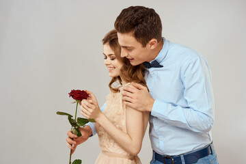 lovers men and woman hugs romance love red rose light background