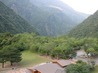 Beautiful view of the mountain and the green forest  with houses