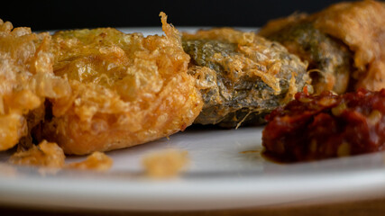Bandeng Presto Goreng. Fried tendered-bone milkfish served with traditional side dishes