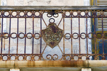 wrought iron and rusty balcony in Ermoupoli, Syros island Greece