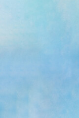 Blue gradient texture wall with some small white spots and dirt. Artistic cloudy watercolor background.