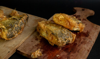 Bandeng Presto Goreng. Fried tendered-bone milkfish served with traditional side dishes