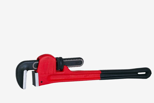 Red pipe wrench isolated on white background