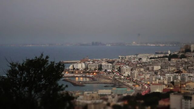 Time lapse algiers before twilight in a cloudy day